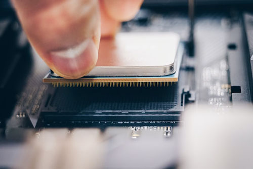 Person Fixing The Processor To the Circuit