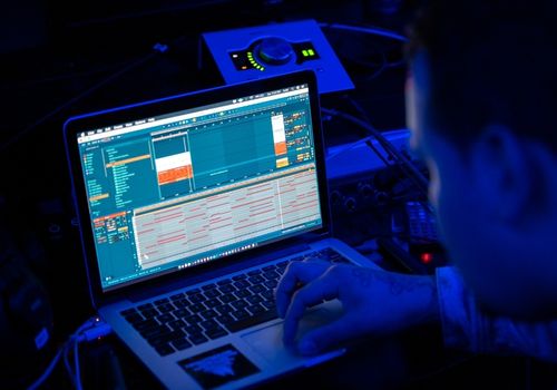 Man Using His Laptop At Workplace