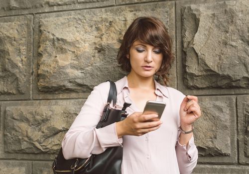 Young Woman Texting on the Mobile