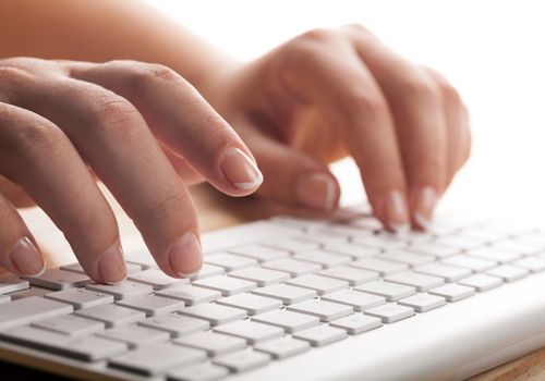 Woman Typing on a Keyboard