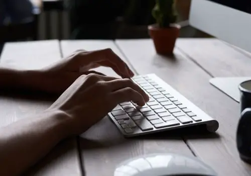 Person Using A Keyboard