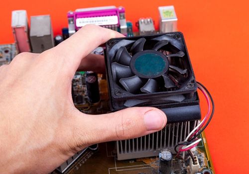 A Man Adjusting CPU Fan