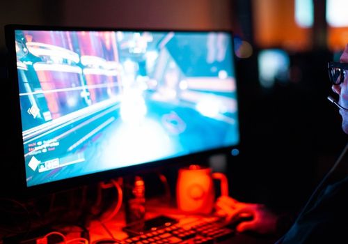 Person Playing FPS Games Using PC