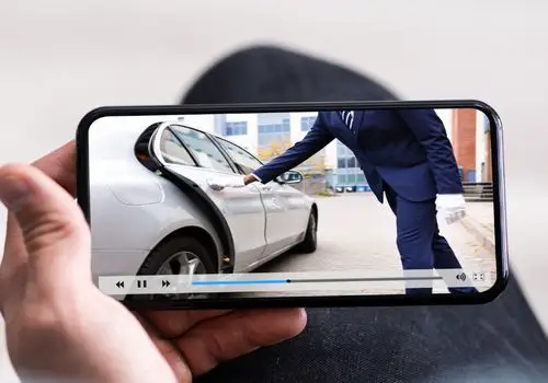 Person Watching A Video Using Mobile Phone