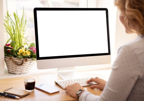 Woman Working with Desktop Computer at Home