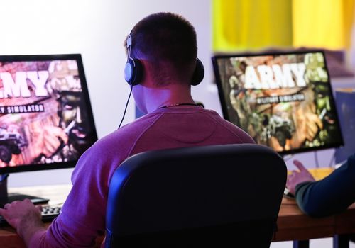 Young People Playing Video Games at Tournament