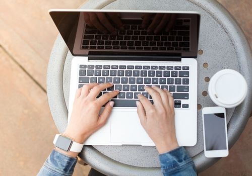 Lady Typing on a Laptop