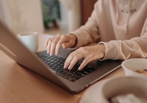 Person Typing on a Laptop