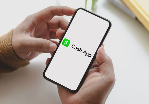 Person Working with Cash App using Smartphone