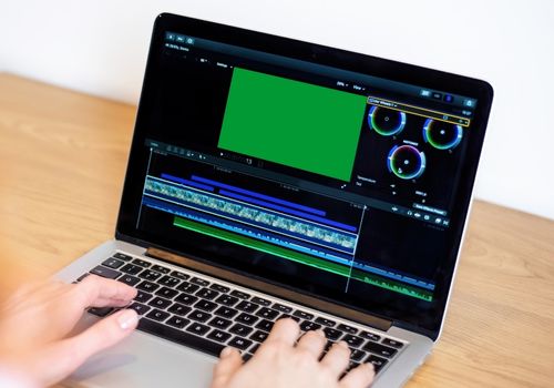 Woman Editing A Video On Laptop