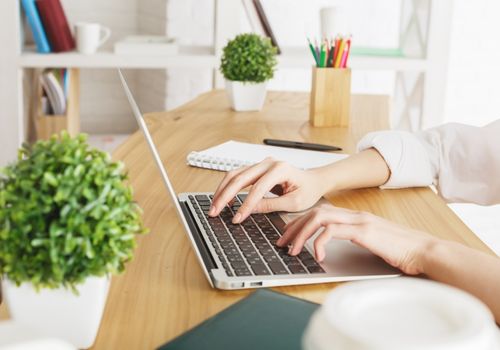 Woman Working with a Laptop