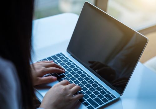 Woman Working with a Laptop