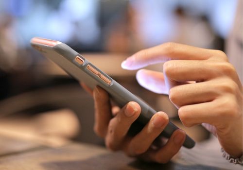 Female Checking Her Mobile Phone