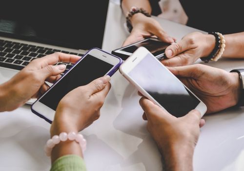 Group of Young People Holding Smartphones