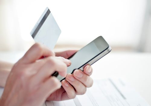 Person Paying the Bill on Mobile Using Debit Card