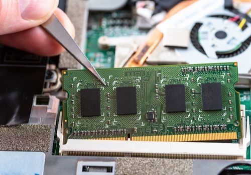 RAM Stick Being Inserted into a Memory Slot