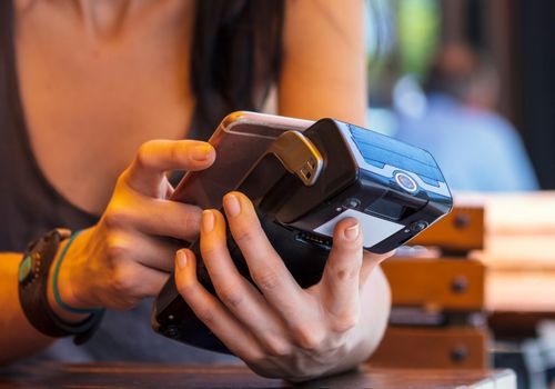 Woman Making Contactless Payment at a Store