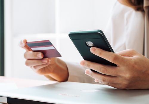 Woman Making Payment Using Debit Card