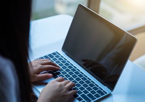 Woman Using Laptop