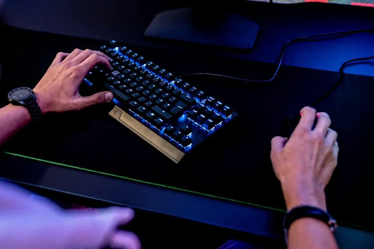 Gamer Controlling the Keyboard and Mouse