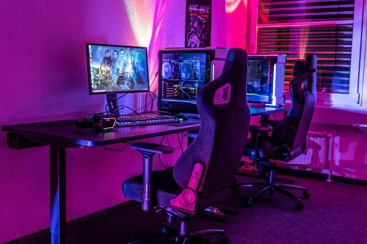 Gaming Room with Dual Set of Gaming PC's and Pink Lights
