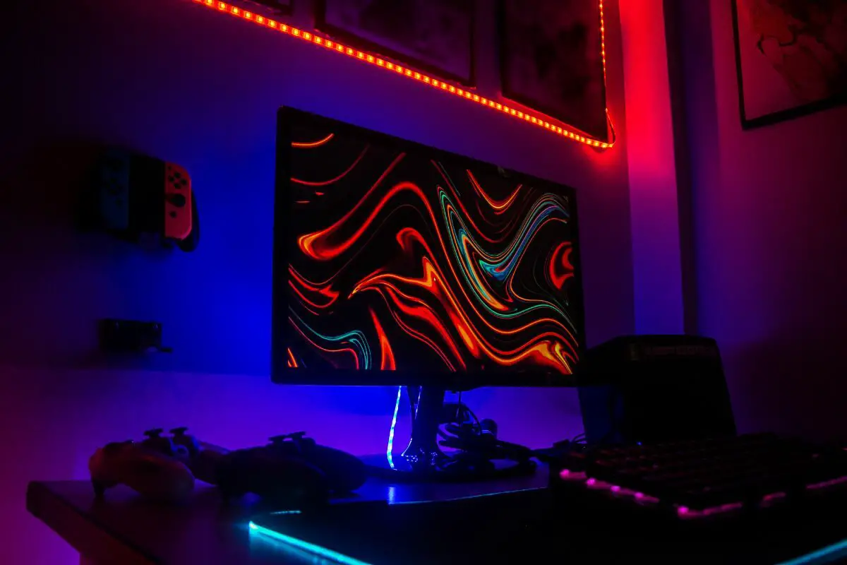 Gaming Room with PC, Gadgets, and Colorful Wall Lights