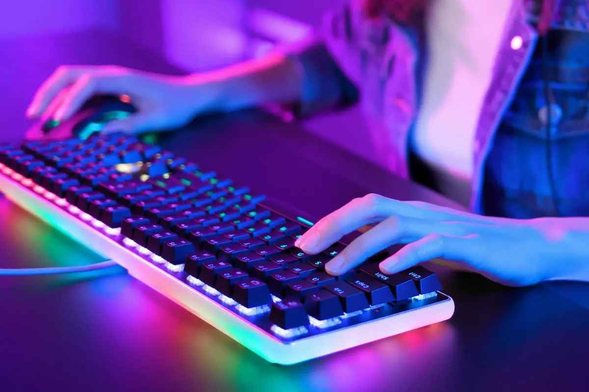 Girl Playing PC Games Using RGB Keyboard
