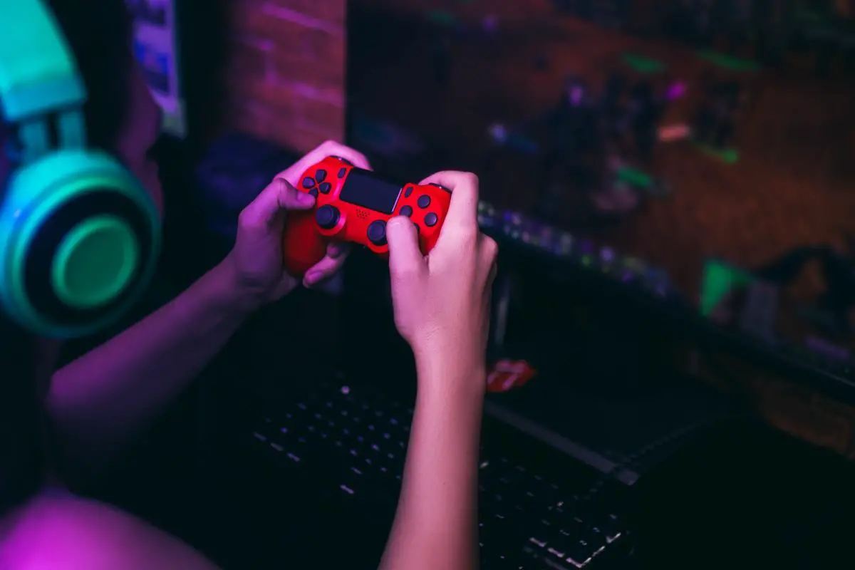 Girl Playing a Game with a Joystick
