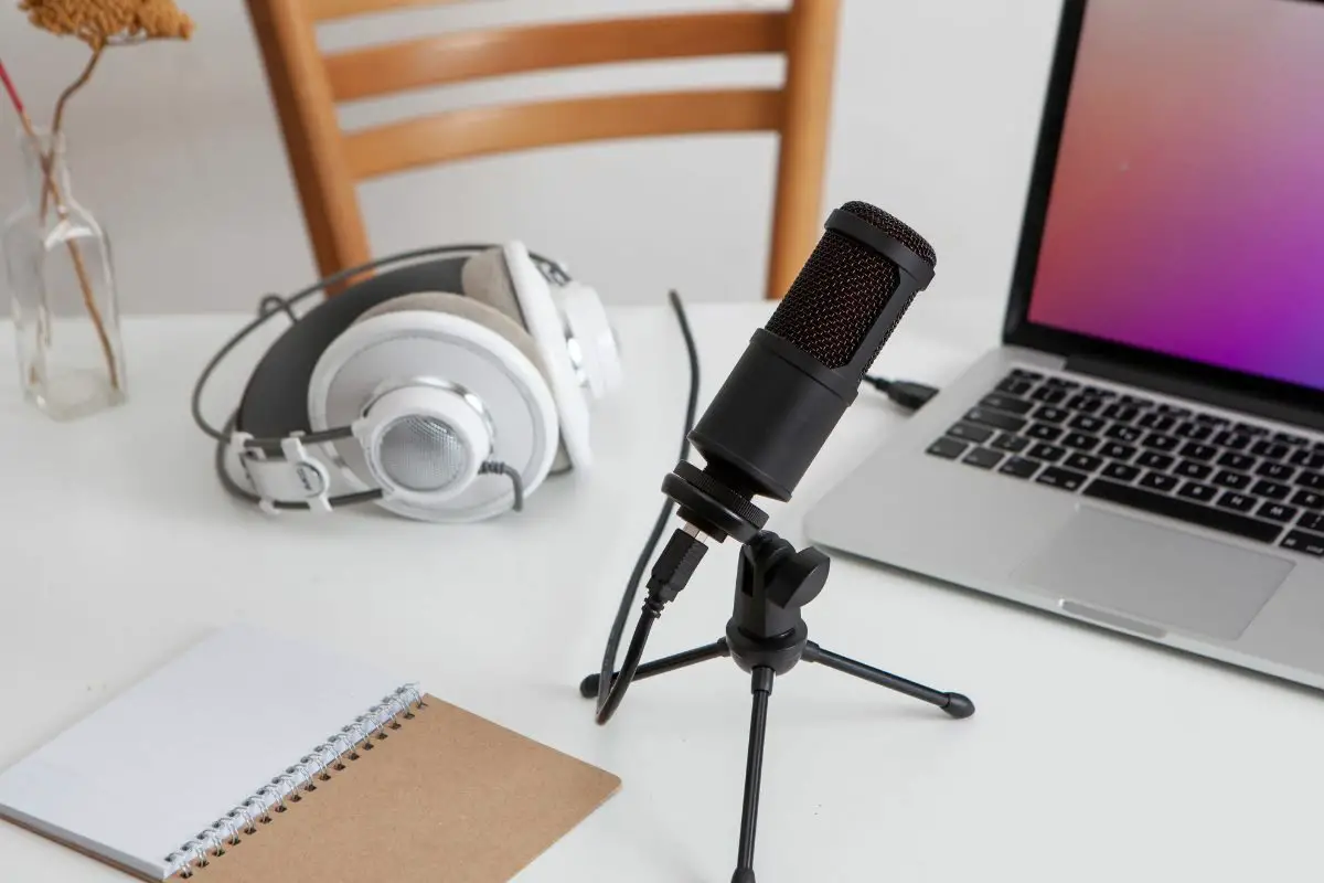 Headphones, Microphone, Laptop and Notebook on White Desk