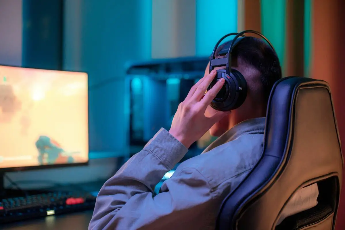 Man with Headphone Playing PC Games