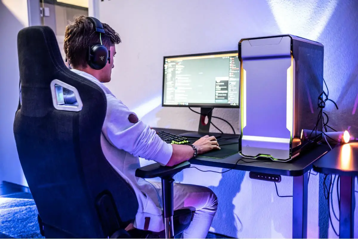 Man with Headsets working on a PC