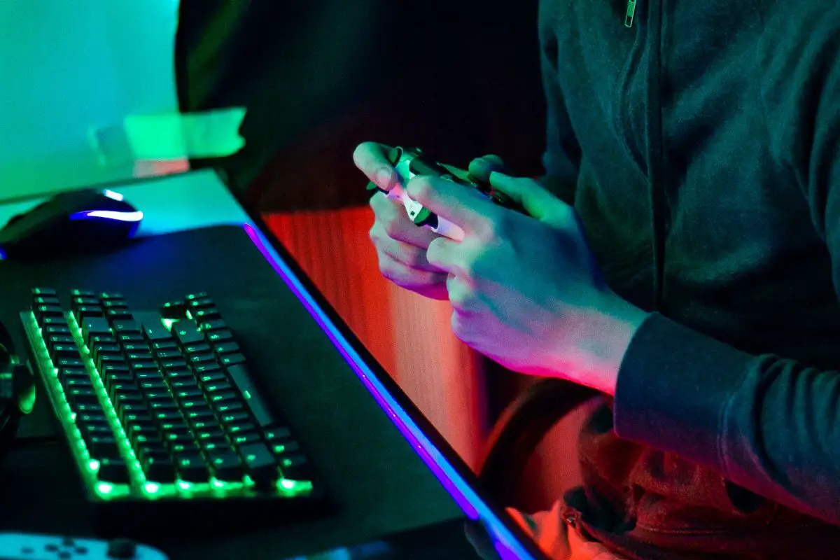 Player with Gaming Controller and Gaming Keyboard