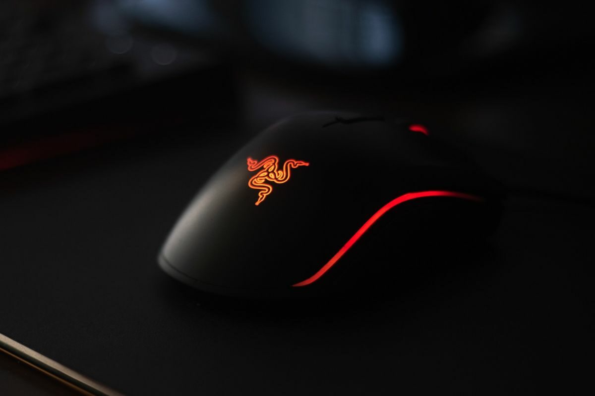 Black and Red Mouse Placed on the Mouse Mat