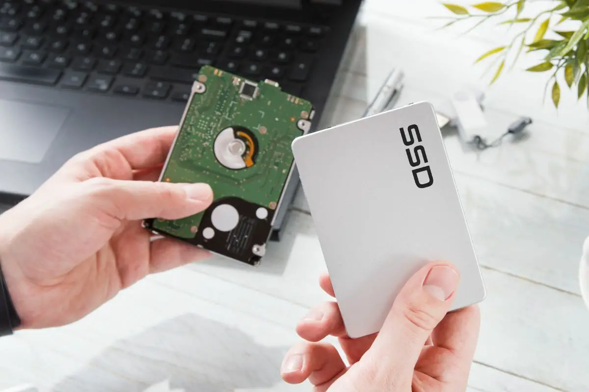Man Changing Hard Drive Disk to a Modern SSD