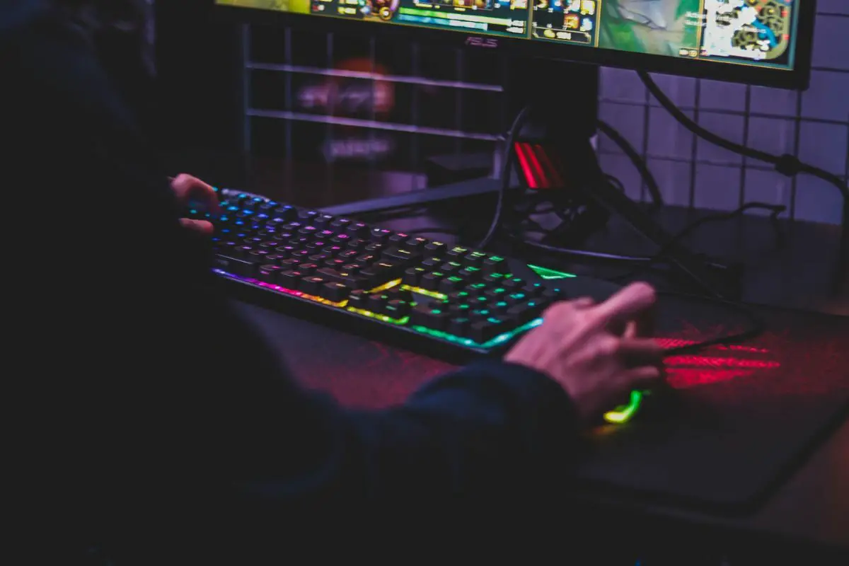 Man Playing Games with Gaming Keyboard and Mouse