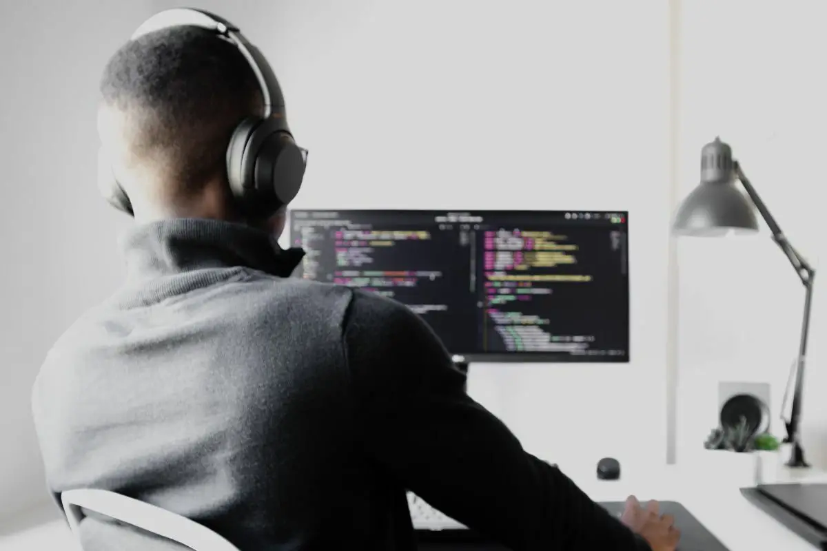 Man with Headphones Using a PC