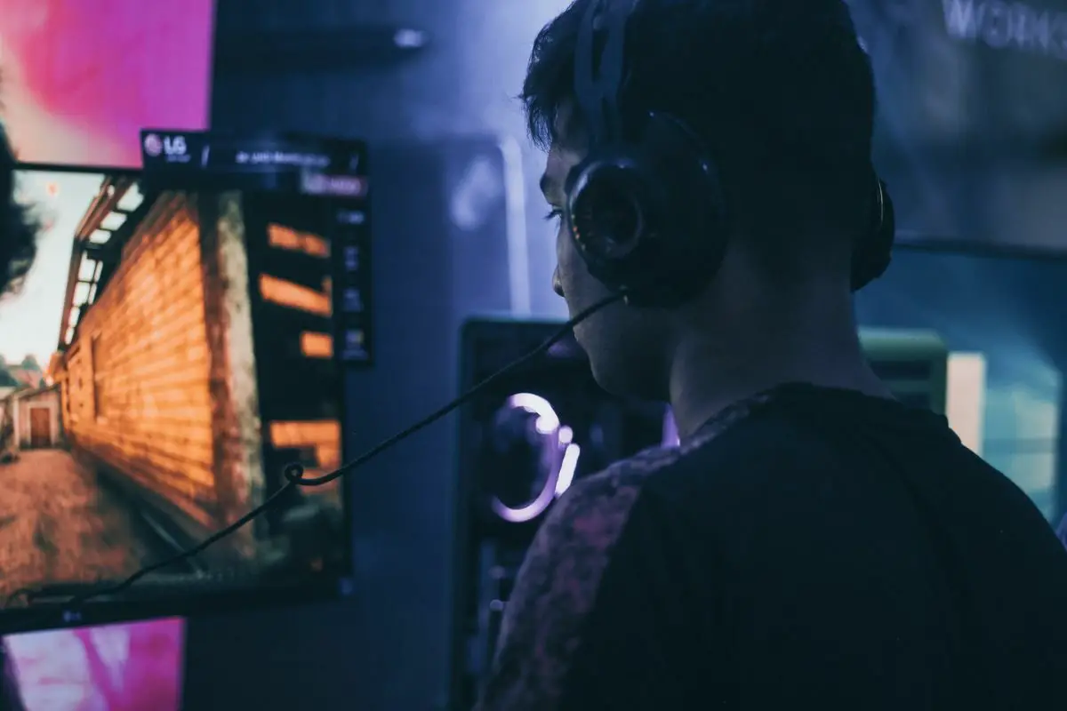 Man with Headset Staring at the Computer Monitor