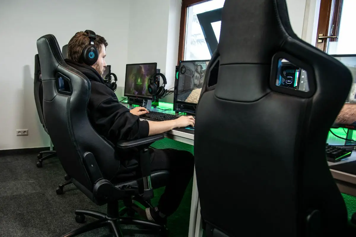 Man with Headsets Playing Games at Gaming Hub