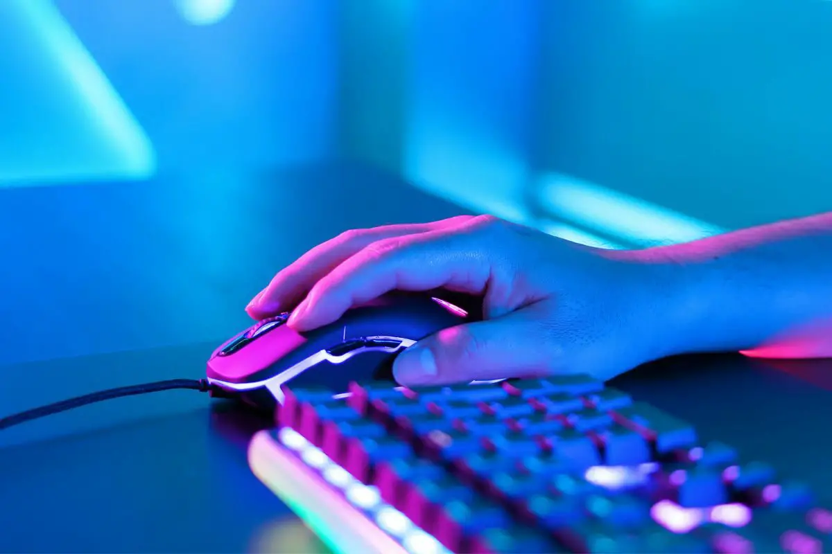 Online Gamer Playing Games with RGB Keyboard and Mouse