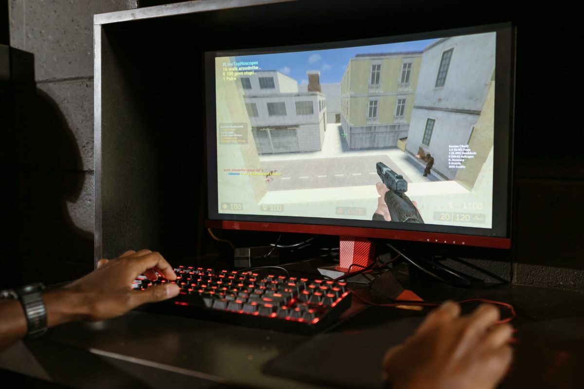 Person Playing Counter-Strike PC Game