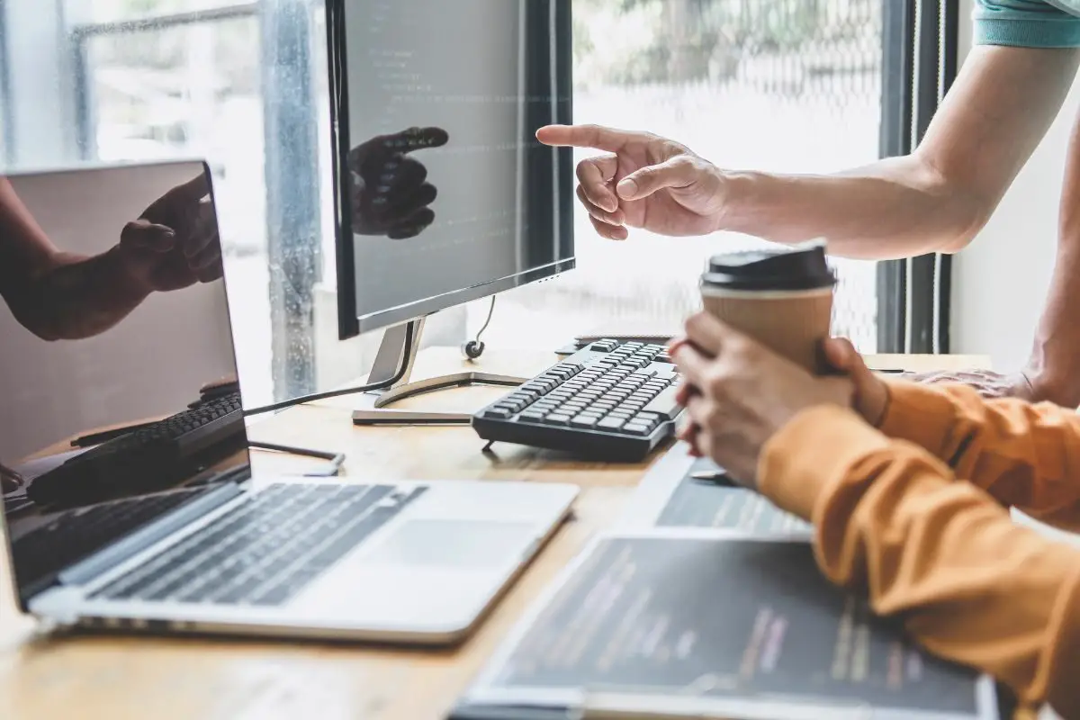 Two People Working in front of Computers