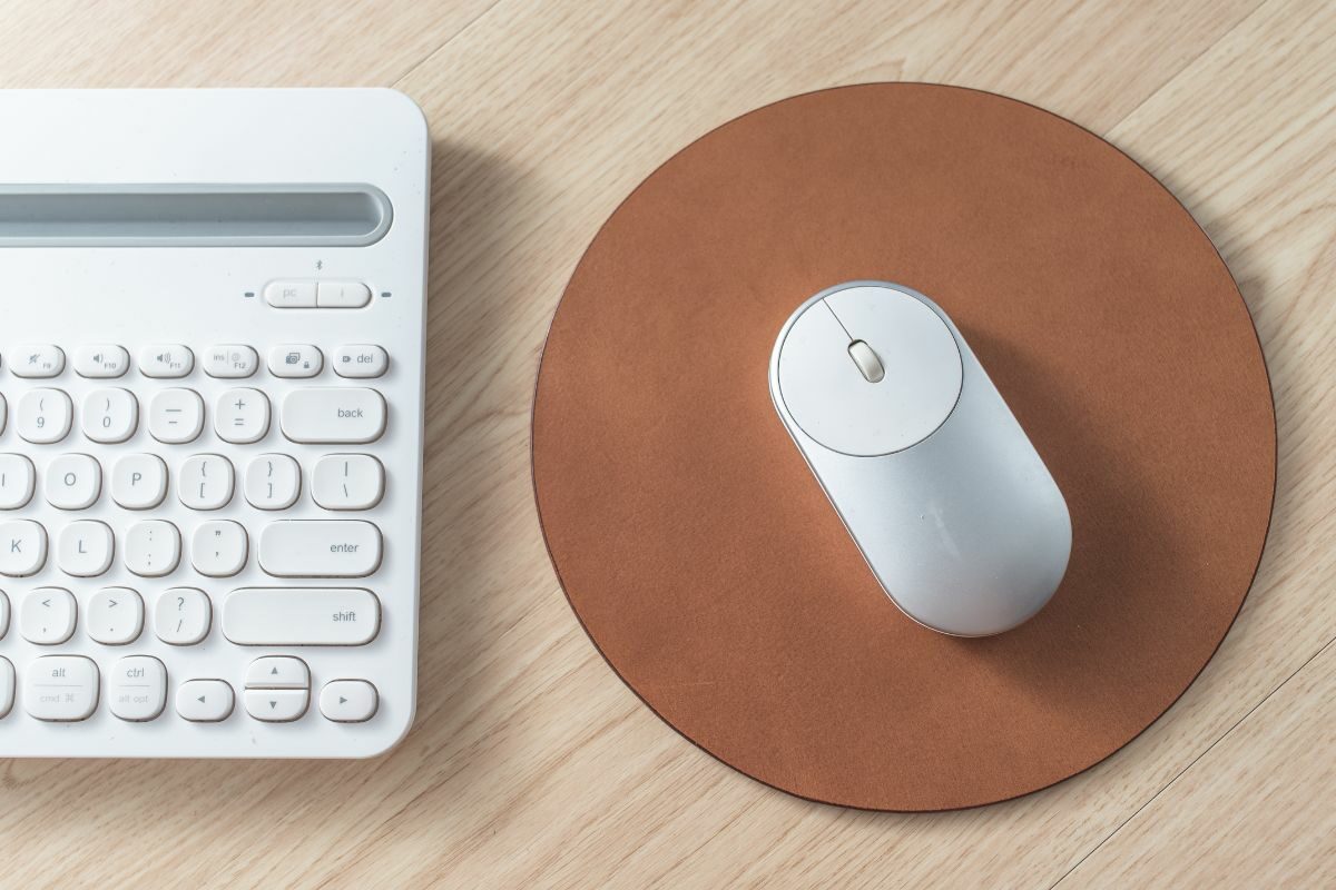 Wireless Mouse Placed on top of Leather Mouse Pad