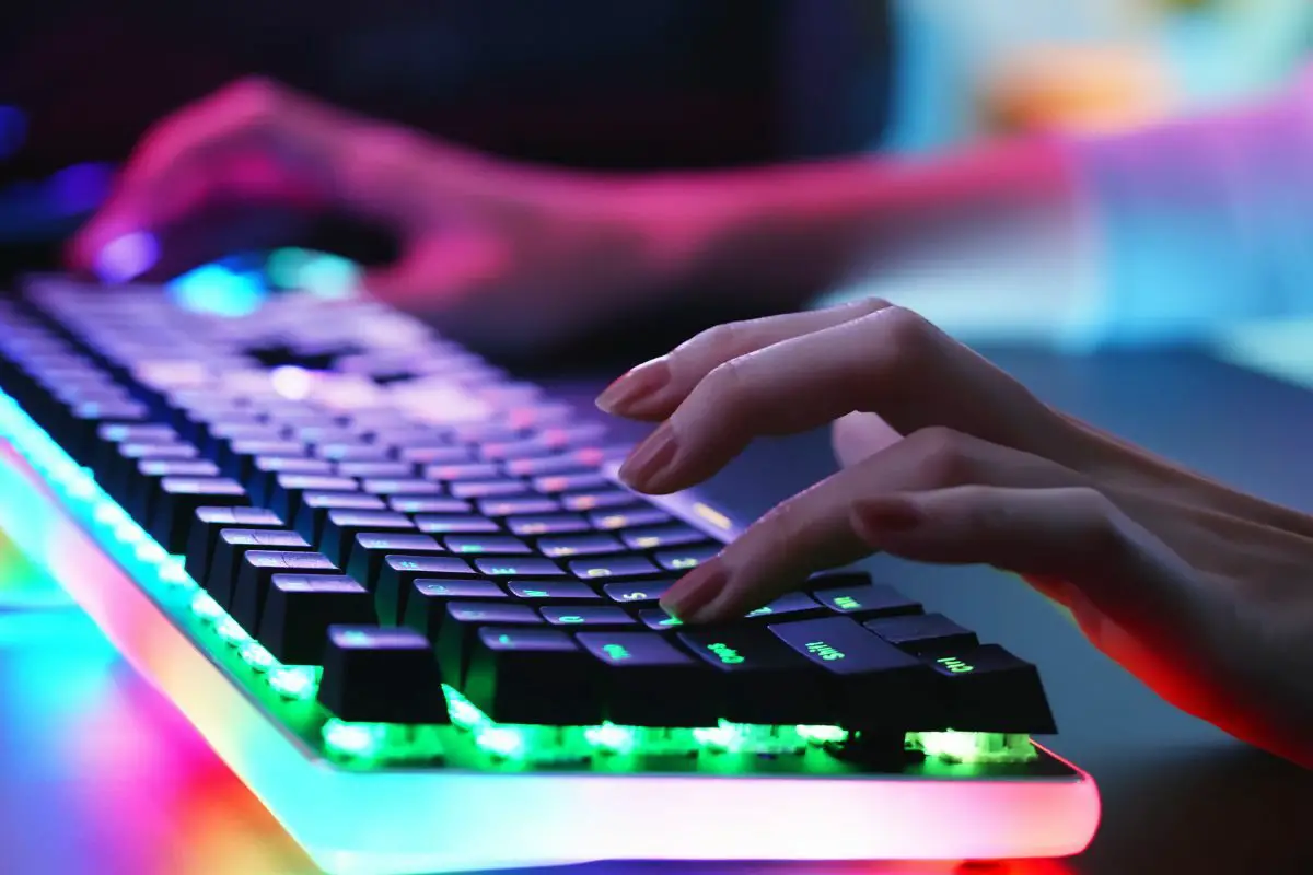 Woman Playing Games with RGB Keyboard