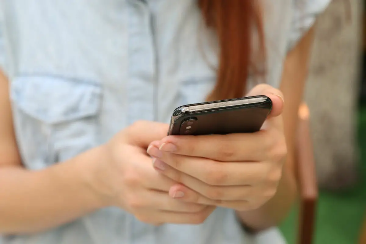 Young Lady Holding a Smartphone