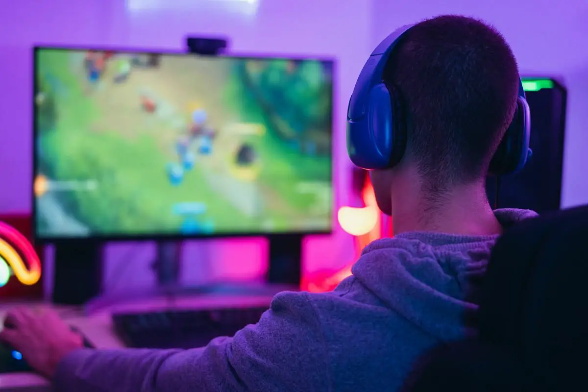 Young Man with Headsets Playing Games