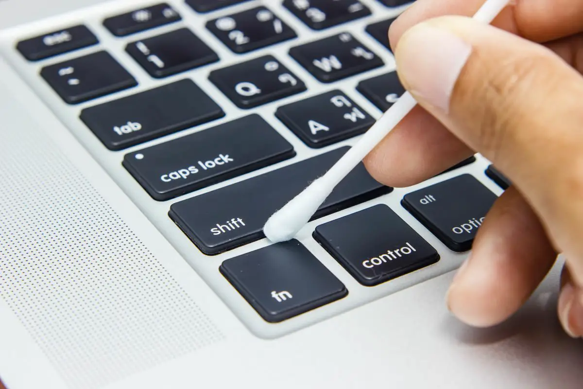 Cleaning Keyboard Using Cotton Bud