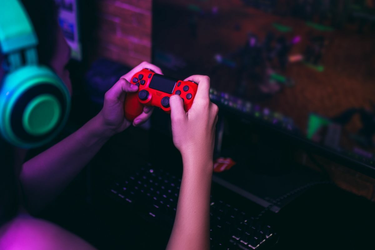 Person Playing a Game with a Console