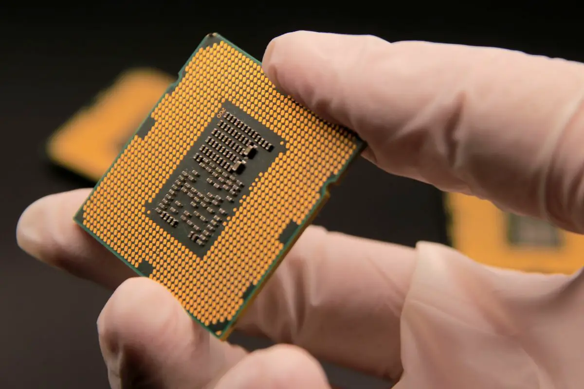 Technician Holding an Intel CPU