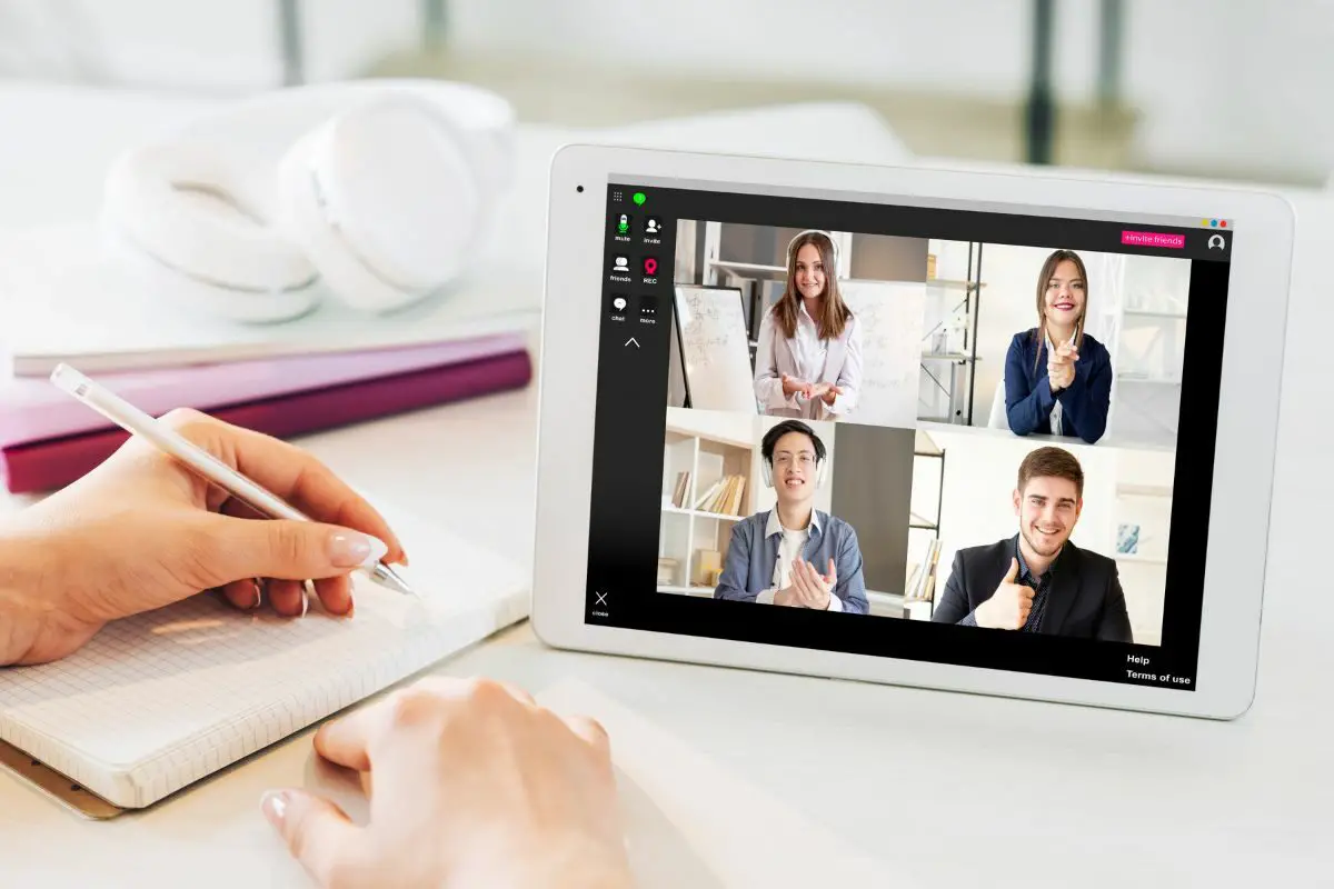 Woman Attending Virtual Conference Using Tab