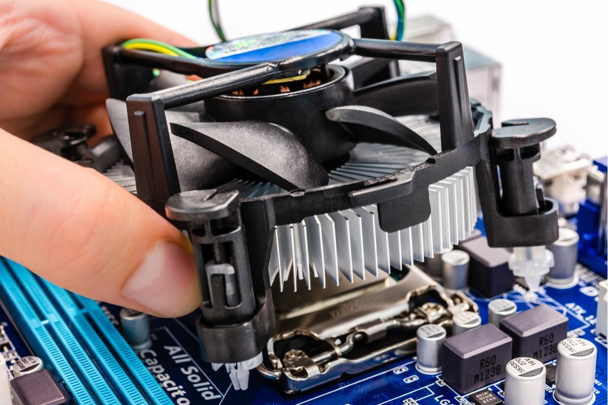 Person Installing CPU Cooler on the Motherboard